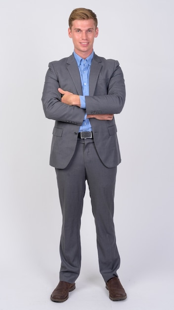 Close up of young handsome businessman with blond hair isolated