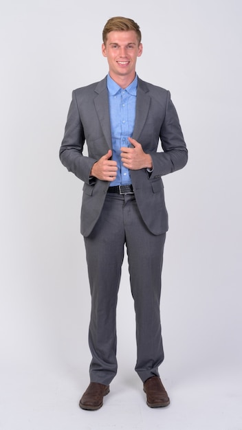 close up of young handsome businessman with blond hair isolated