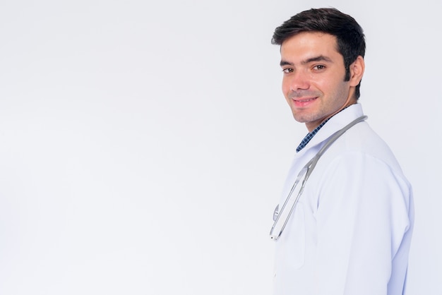 Close up of young handsome Persian man doctor isolated