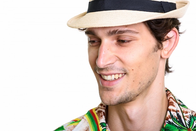 Close up of young happy man smiling while looking down