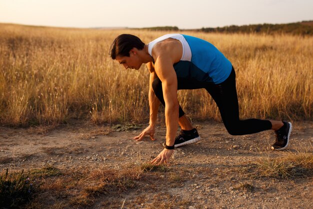 Close-up of a young man doing exercises outdoors