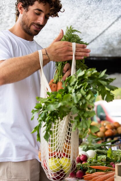 Close up on young man at the food market