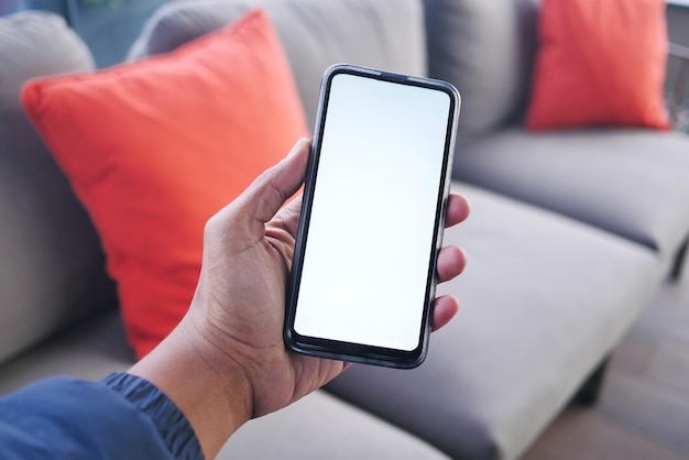 Close up of young man hand using smart phone