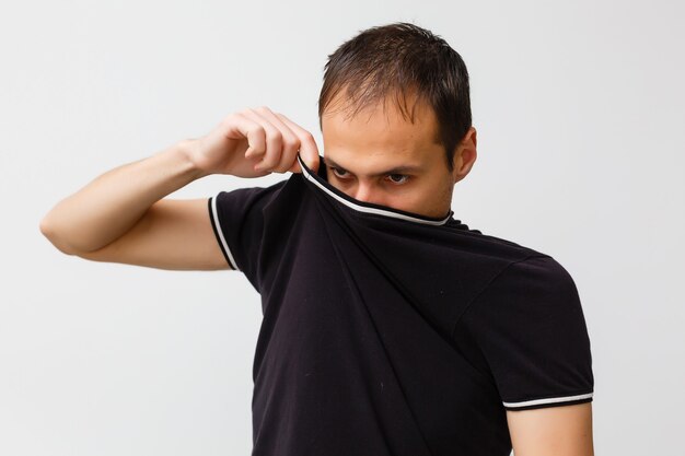 Close-up of a young man having a cough