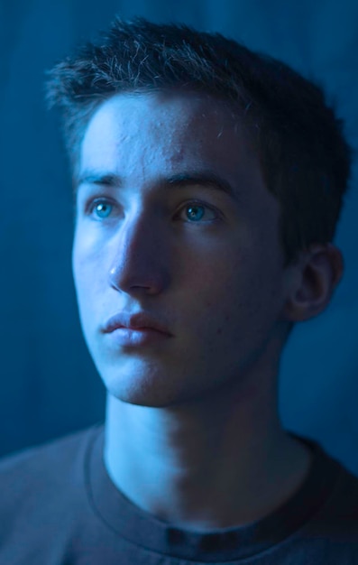 Close-up of young man looking away