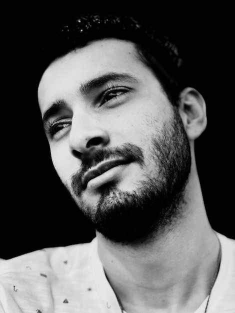 close-up of young man looking away