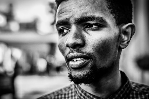close-up of young man looking away