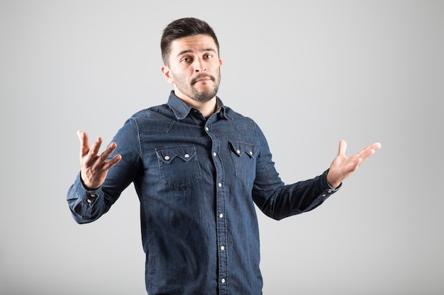 Close up on young man making gesture isolated