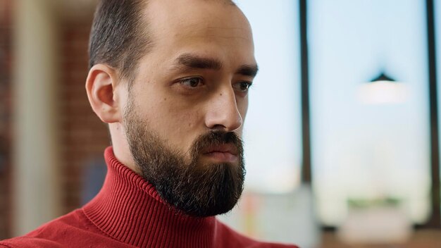 Close-up of young man in office