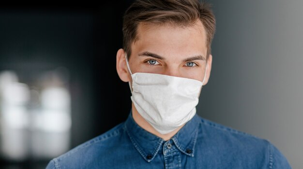 Close up. young man in a protective mask. concept of health protection.