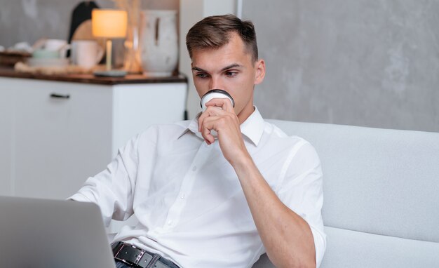 Close up. young man relaxing sitting on the couch .