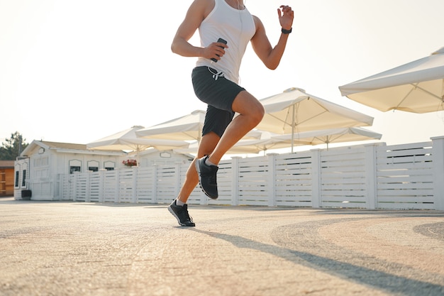 Close up young man running