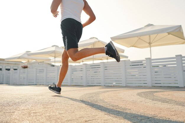 Close up young man running