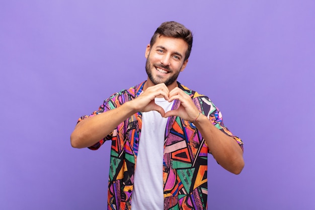 Close up on young man smiling and feeling happy