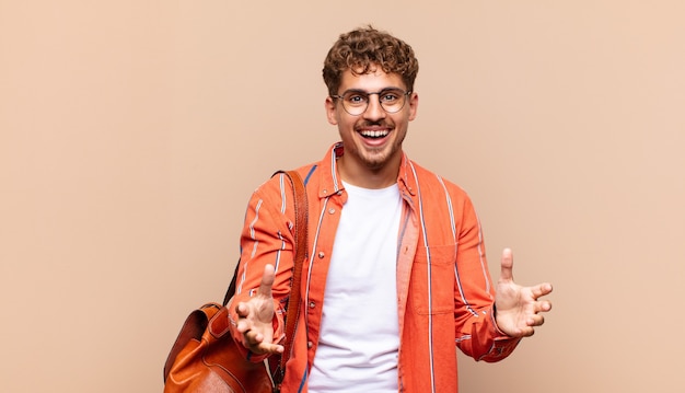 Close up on young man smiling in the studio