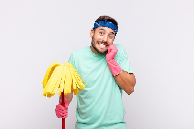 Close up on young man with cleaning tools