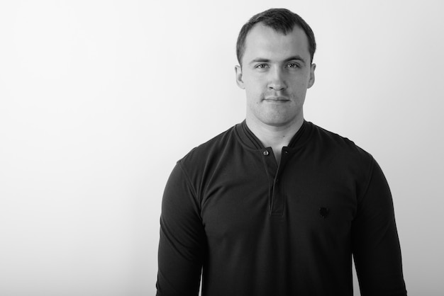 Close up of young muscular man in black and white