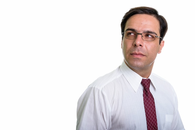 Close up of young Persian businessman thinking with eyeglasses