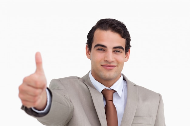 Close up of young salesman giving thumb up