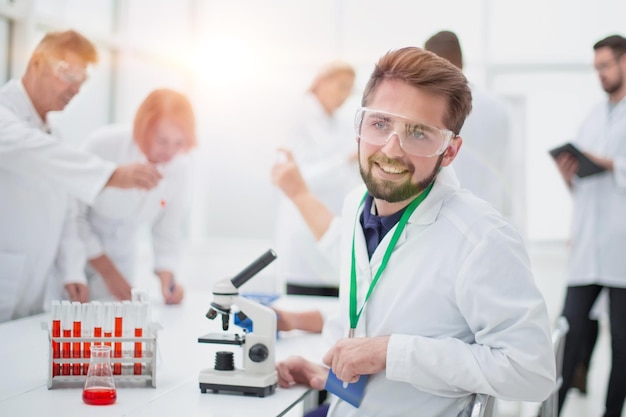 close up. young scientist is working with a microscope in the laboratory .