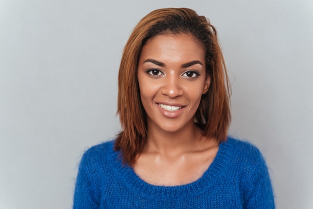 Close up young smiling african woman in sweater