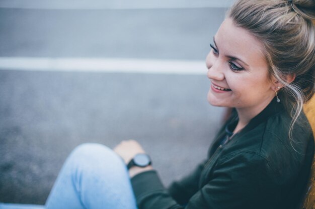 Close-up of young woman against sea