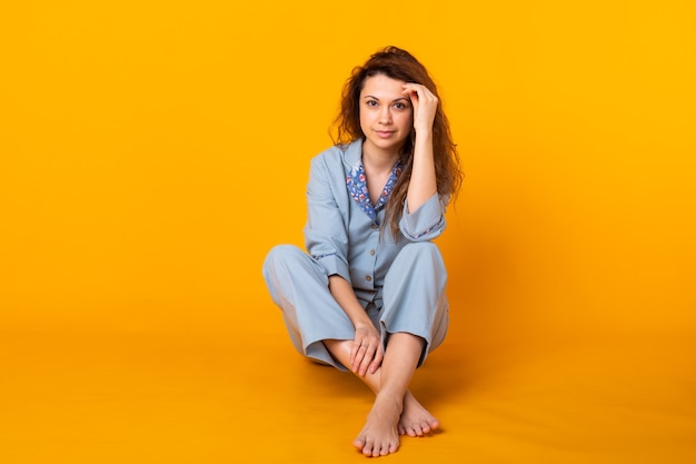 Close up young woman in blue home wear