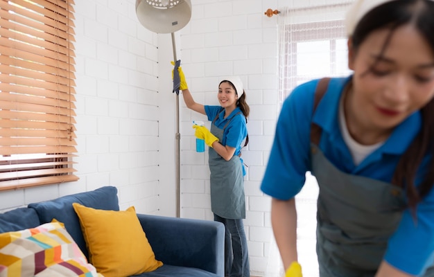 Close up of young woman cleaning floor with mop Housework concept