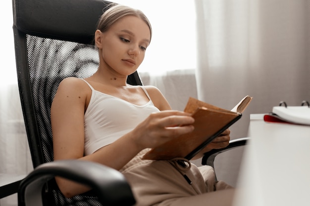 Close up on young woman learning and reading