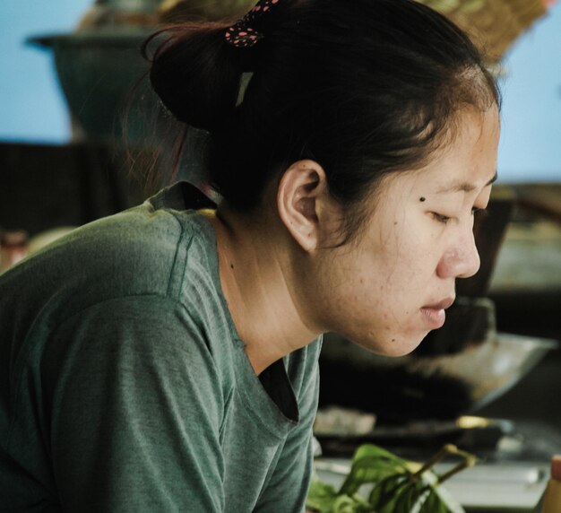 Close-up of young woman looking away