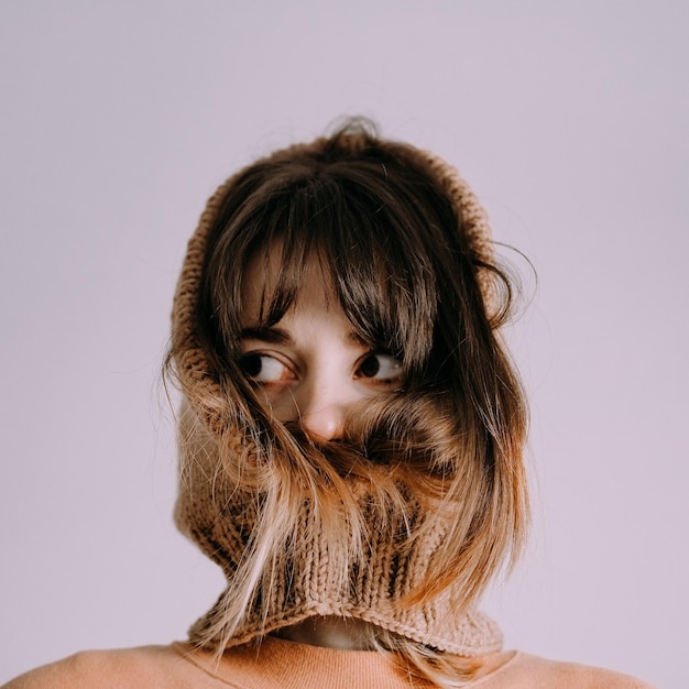 Close-up of young woman wearing hat