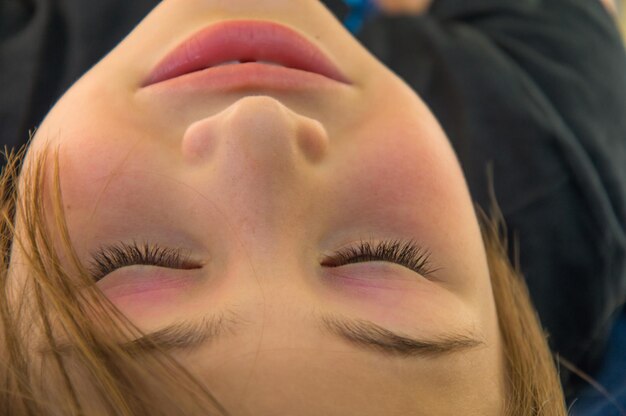 Close-up of young woman with eyes closed