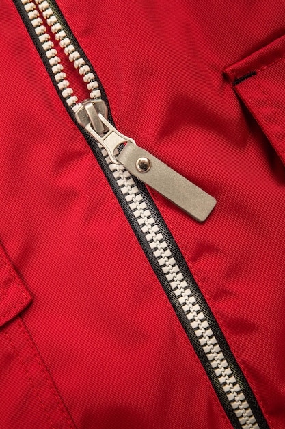 Close up zipper on a red background