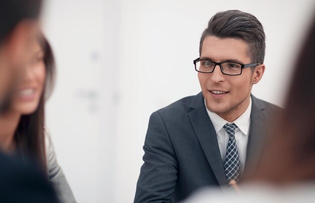 Close upa young businessman discusses new ideas with the business teamphoto with copy space