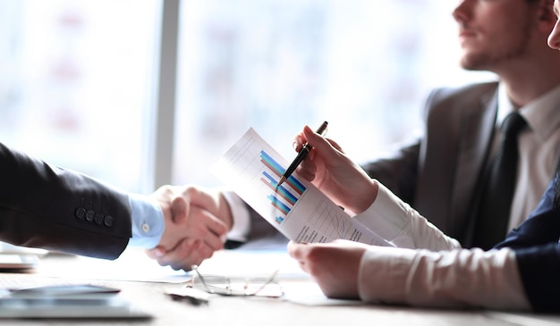 Close upbusiness partners at the Desk in the office