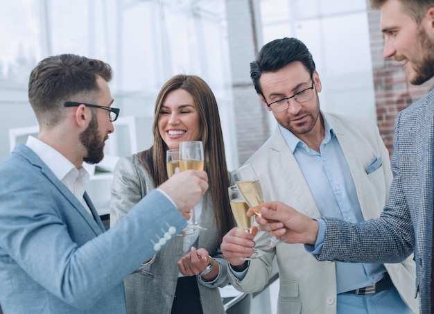 Close upbusiness people celebrate with champagnethe concept of success