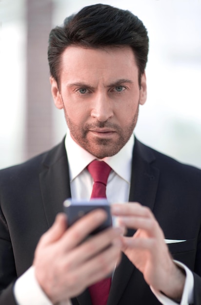 Close upbusinessman is typing sms