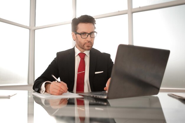 Close upbusinessman sitting at his Deskbusiness concept