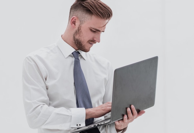 Close upbusinessman in white shirt using laptop