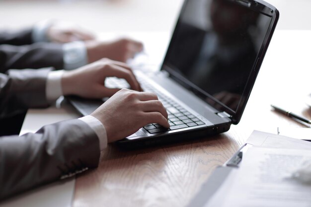 Close upbusinessman working on the laptop people and technology