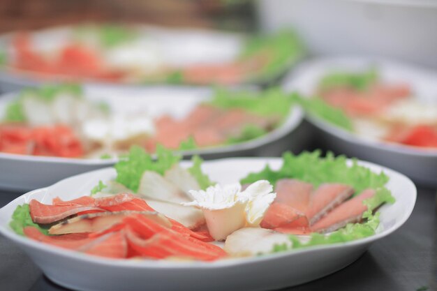 Close updishes with fish fillet on the kitchen table in the res