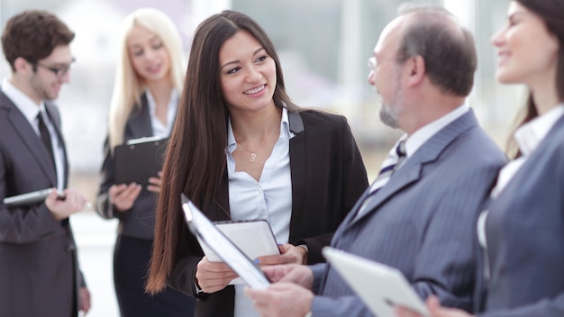 Close upgroup of business people preparing to start a business meeting