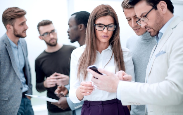 Close upgroup employee reading SMS on smartphone