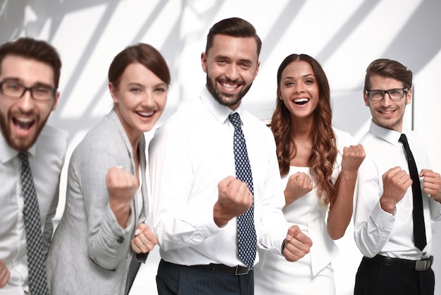 Close uphappy business team standing in office