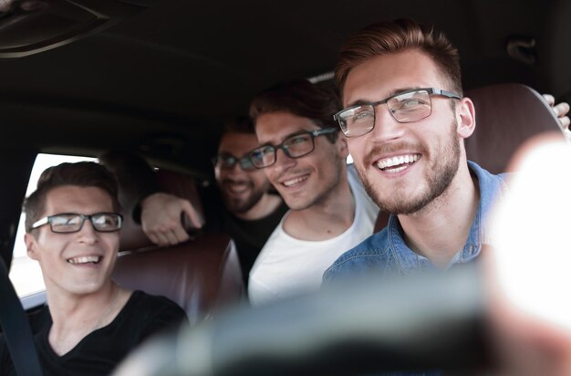 Close uphappy friends talking in the car