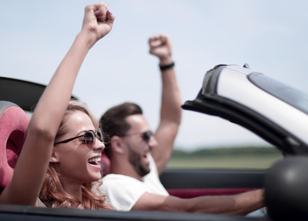 Close uphappy loving couple traveling in a car