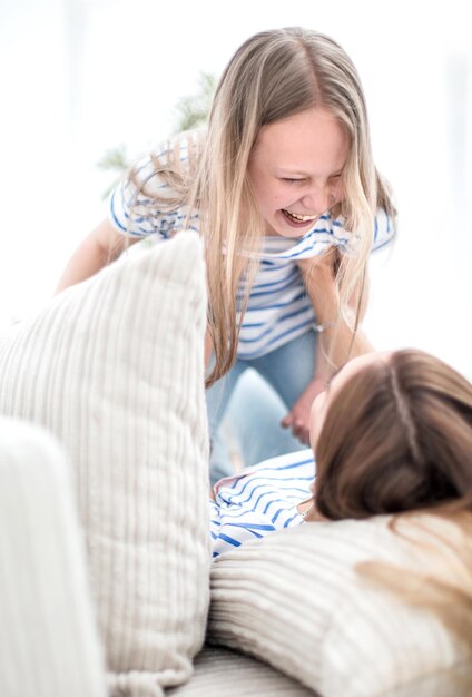 Close uphappy mom and daughter spend their free time together