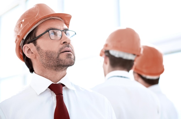 Close upmodern businessman in a protective helmet