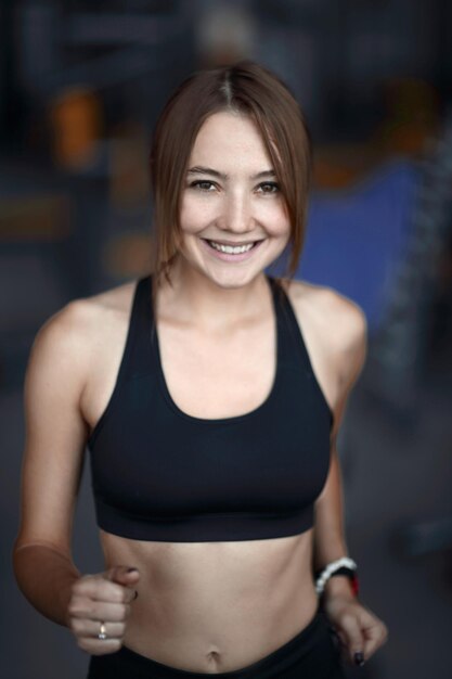 Close upportrait of an attractive woman in the gym