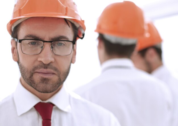 Close upportrait of a confident businessman in a protective helmet